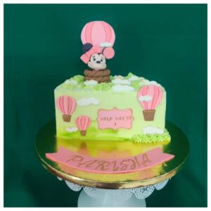 Celebrate your little one’s halfway mark to the big First Birthday with this cute and colorful Hot Air Balloon–themed cake. Designed in soft pink tones to instantly catch a toddler’s attention, this cake features a charming hot-air balloon setup along with Minnie-inspired elements — making it picture-perfect for your tiny princess. Inside, the cake hides a delicious dark chocolate flavour, loved by kids and adults alike. A cheerful treat that brought joy and smiles to the entire family, making the celebration beautifully memorable.